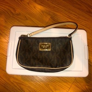 Small used Brown Michael Kors clutch with straps